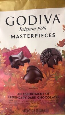 An Assortment Of Ganache Heart, Mint Medallion, Raspberry Star Legendary Dark Chocolates, Dark Chocolates