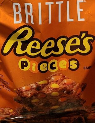 A Thin Crunchy Brownie Topped With Reese's Pieces Candy, Reese's Pieces