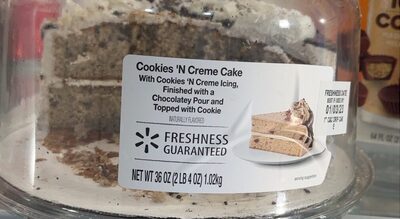 Cookies N' Creme Cake Iced With Cookies N' Creme Buttercreme Flavored Icing, Finished With A Chocolatey Pour And Topped With A Cookie, Cookies N' Creme