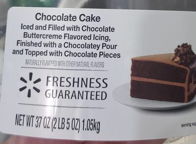 Chocolate Flavored Cake Iced And Filled With Chocolate Buttercreme Flavored Icing, Finished With A Chocolatey Pour And Topped With Chocolate Pieces, Chocolate