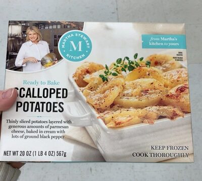 Scalloped Thinly Sliced Potatoes Layered With Generous Amounts Of Parmesan Cheese, Baked In Cream With Lots Of Ground Black Pepper