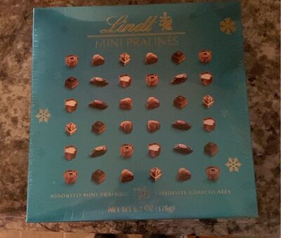 Assorted Mini Pralines Exquisite Chocolates, Hazelnut Nougat With Hazelnut Pieces, Milk Chocolate Cup With Macchiato Creme, Dark Chocolate With Raspberry Caramel & Chocolate Creme, Dark & Milk Chocolate With Caramelized Hazelnut Pieces, Dark Chocolate Wit